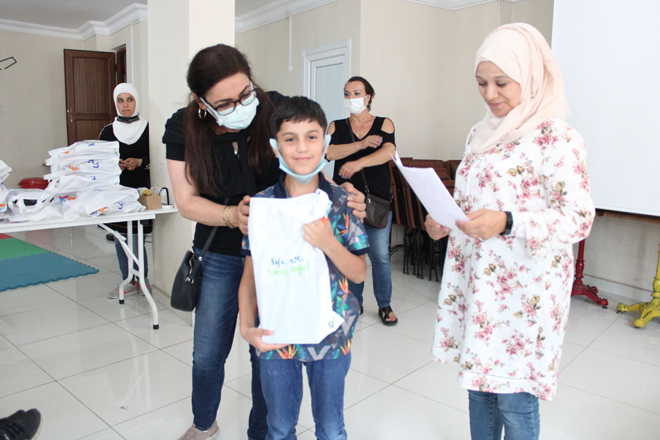 Providing students with clothes by Mrs Mirna Barq.